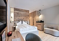 Alpin Spa Hotel die Post in Bormio – Komfortables Doppelzimmer mit Holzwand | Wellnesshotel Alpenregion