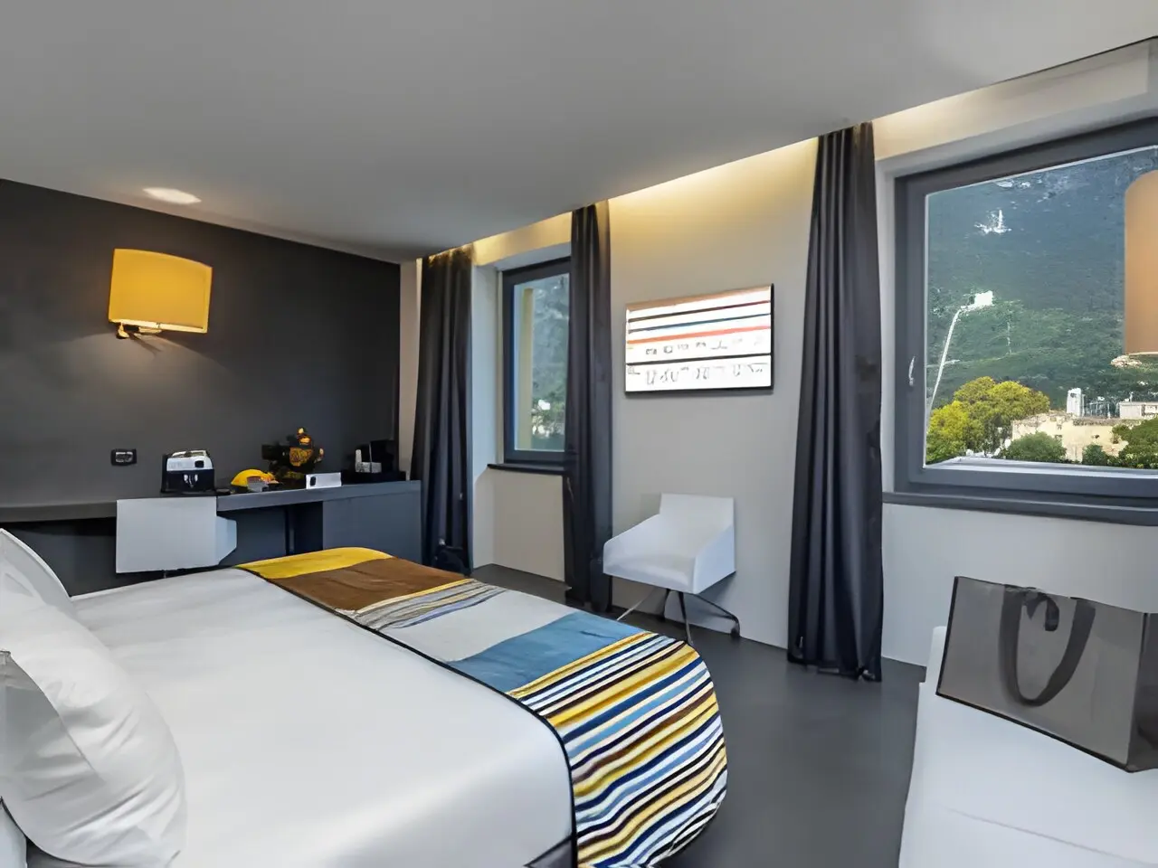 Lido Palace Hotel in Riva del Garda – Gemütliches Zimmer mit Blick ins Grüne | Wellnesshotel Gardasee