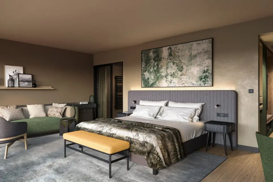 Grand Tirolia Kitzbühel in Kitzbühel – Modernes Hotelzimmer mit großem Bett und Sitzbereich | Wellnesshotel Tirol
